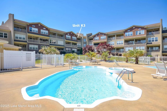 view of swimming pool with a patio area