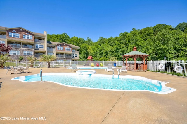 view of swimming pool with a gazebo and a patio