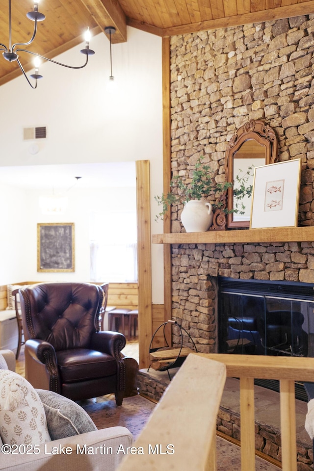 living room with wooden ceiling, hardwood / wood-style flooring, a fireplace, high vaulted ceiling, and beam ceiling