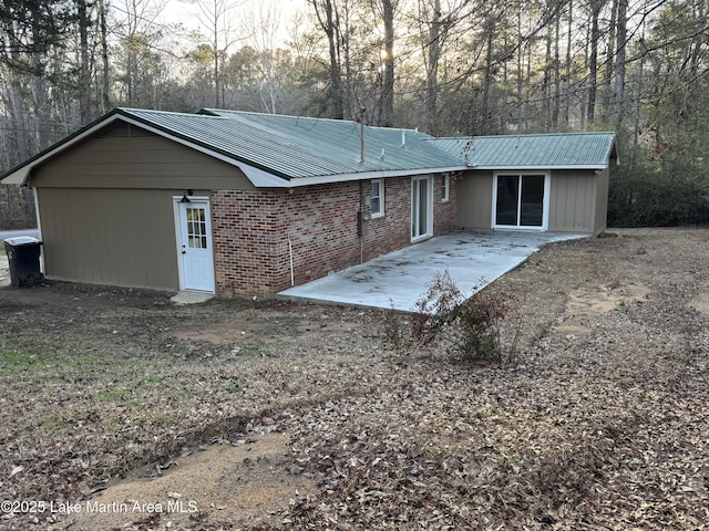 rear view of house featuring a patio