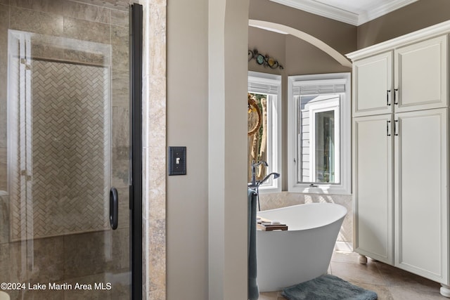 bathroom featuring tile patterned floors, a healthy amount of sunlight, shower with separate bathtub, and ornamental molding