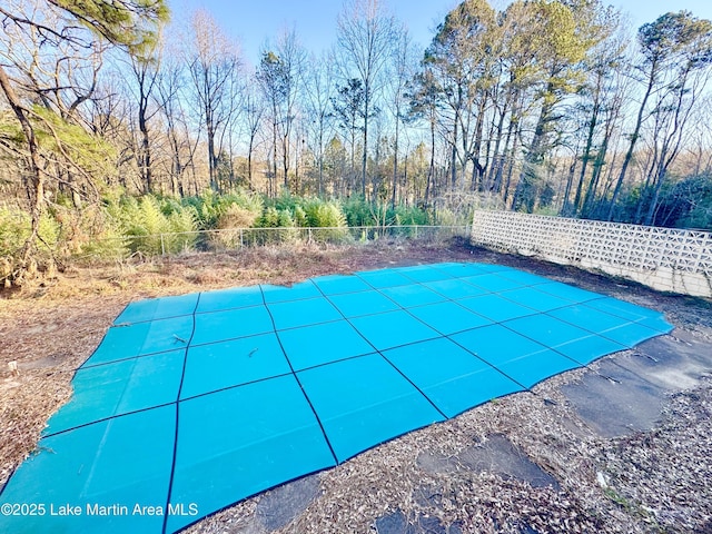 view of pool with fence and a fenced in pool