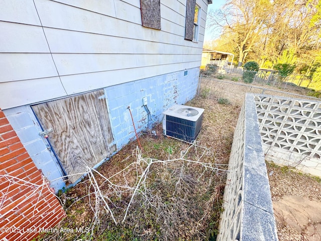 exterior details with crawl space and cooling unit