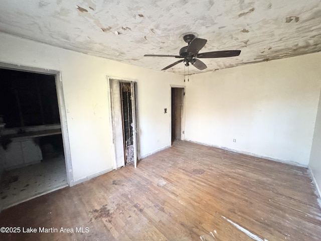 unfurnished bedroom with a closet, ceiling fan, and wood finished floors