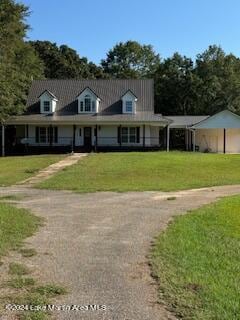 country-style home with a front lawn