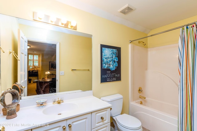 full bathroom with vanity, shower / bath combination with curtain, and toilet