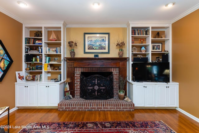 living room with a fireplace, light hardwood / wood-style flooring, and ornamental molding