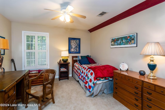 carpeted bedroom with ceiling fan and crown molding