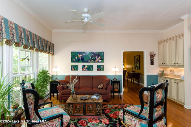 living room featuring crown molding, ceiling fan, and hardwood / wood-style flooring