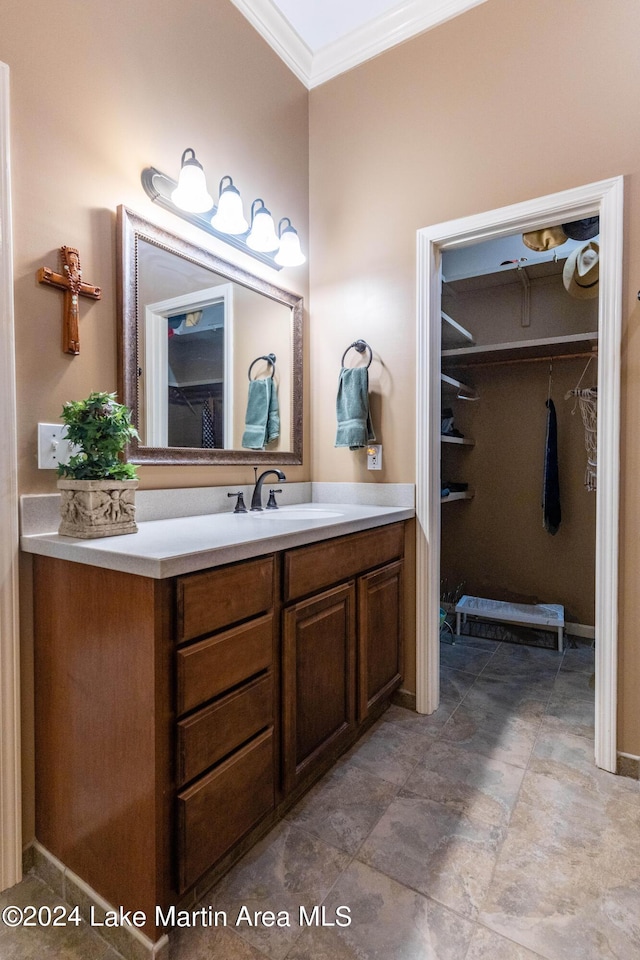 bathroom with vanity and ornamental molding