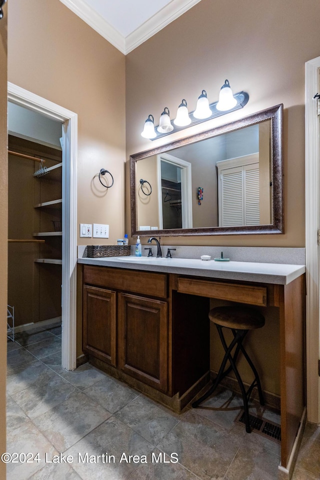 bathroom featuring vanity, ornamental molding, and walk in shower