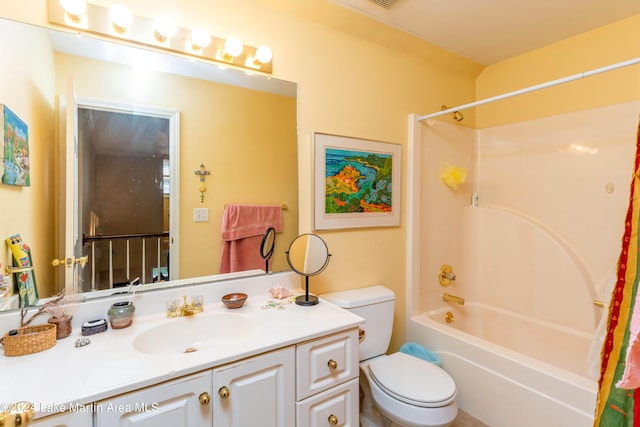 full bathroom featuring vanity, shower / bath combination, and toilet