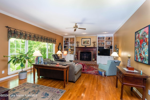 living room featuring crown molding, a healthy amount of sunlight, and light hardwood / wood-style floors