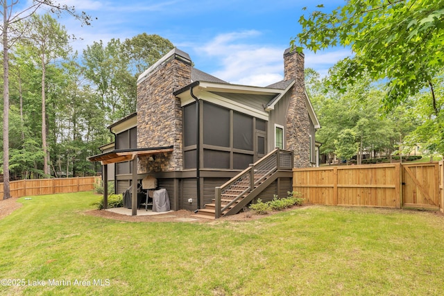 116 Glynmere Park, Alexander City, AL 35010 - rear view of property featuring a chimney, a gate, a sunroom, stairway, and stone siding