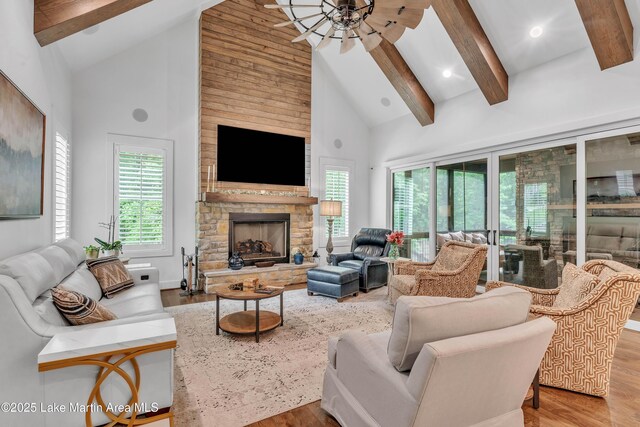 116 Glynmere Park, Alexander City, AL 35010 - living area with high vaulted ceiling, ceiling fan, wood finished floors, beamed ceiling, and a stone fireplace