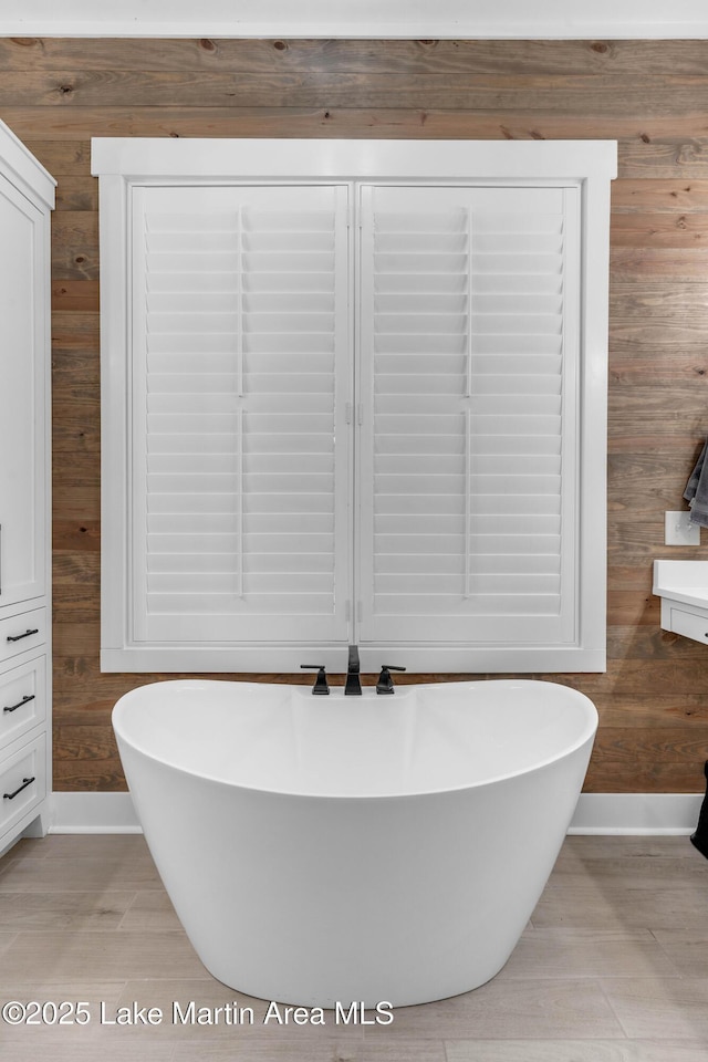116 Glynmere Park, Alexander City, AL 35010 - bathroom with baseboards, wood walls, and a freestanding tub