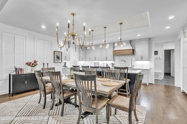 116 Glynmere Park, Alexander City, AL 35010 - dining area with a chandelier, light wood-type flooring, recessed lighting, and a tray ceiling