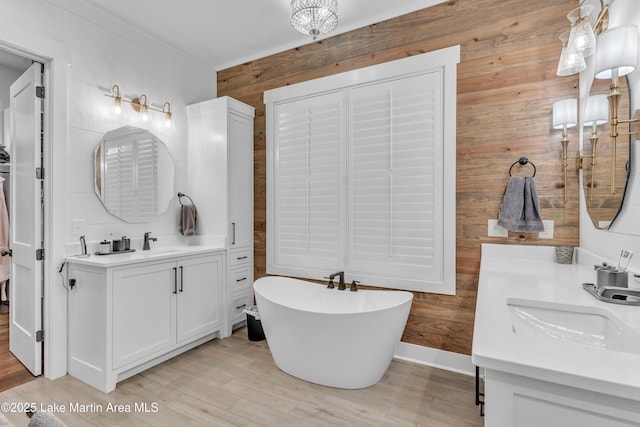 116 Glynmere Park, Alexander City, AL 35010 - full bathroom with wooden walls, wood finished floors, a soaking tub, and two vanities