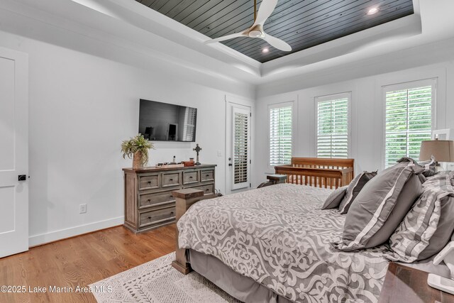 116 Glynmere Park, Alexander City, AL 35010 - bedroom with a tray ceiling, access to outside, light wood-style flooring, baseboards, and wooden ceiling