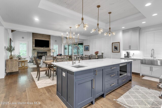 116 Glynmere Park, Alexander City, AL 35010 - kitchen featuring a raised ceiling, a sink, open floor plan, and recessed lighting