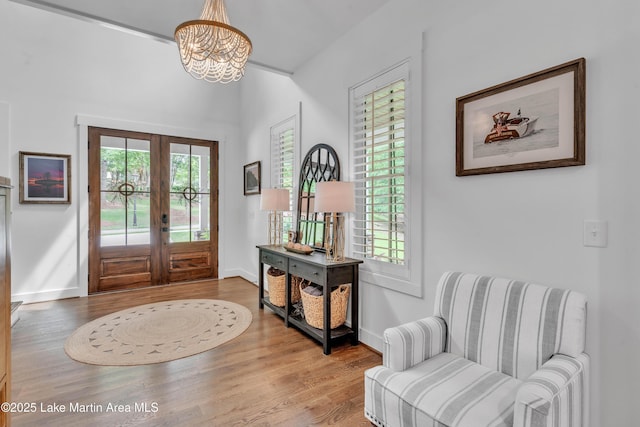 116 Glynmere Park, Alexander City, AL 35010 - foyer entrance featuring french doors, wood finished floors, a chandelier, and baseboards