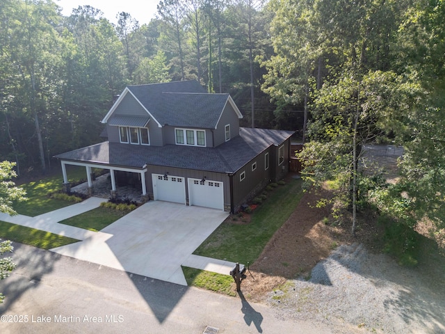 116 Glynmere Park, Alexander City, AL 35010 - view of front of property featuring roof with shingles, concrete driveway, a front yard, and a garage