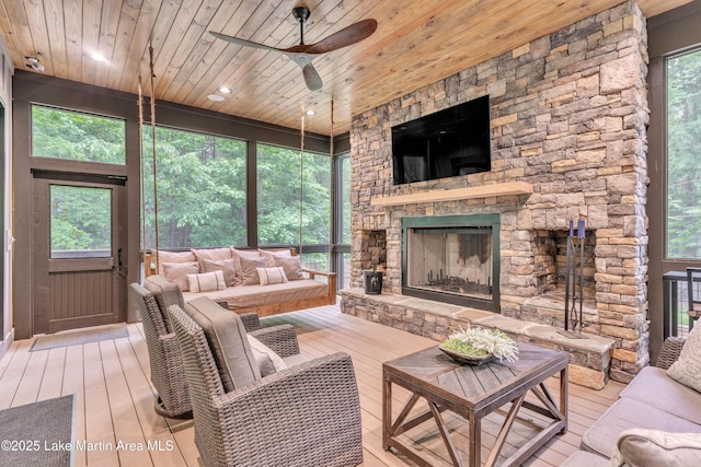 116 Glynmere Park, Alexander City, AL 35010 - living room featuring ceiling fan, a fireplace, wood ceiling, wood-type flooring, and plenty of natural light