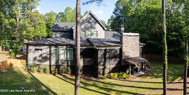 116 Glynmere Park, Alexander City, AL 35010 - rear view of property featuring a shingled roof and a chimney