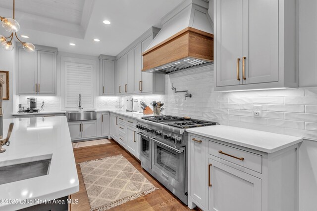 116 Glynmere Park, Alexander City, AL 35010 - kitchen with double oven range, custom exhaust hood, a sink, recessed lighting, and light countertops