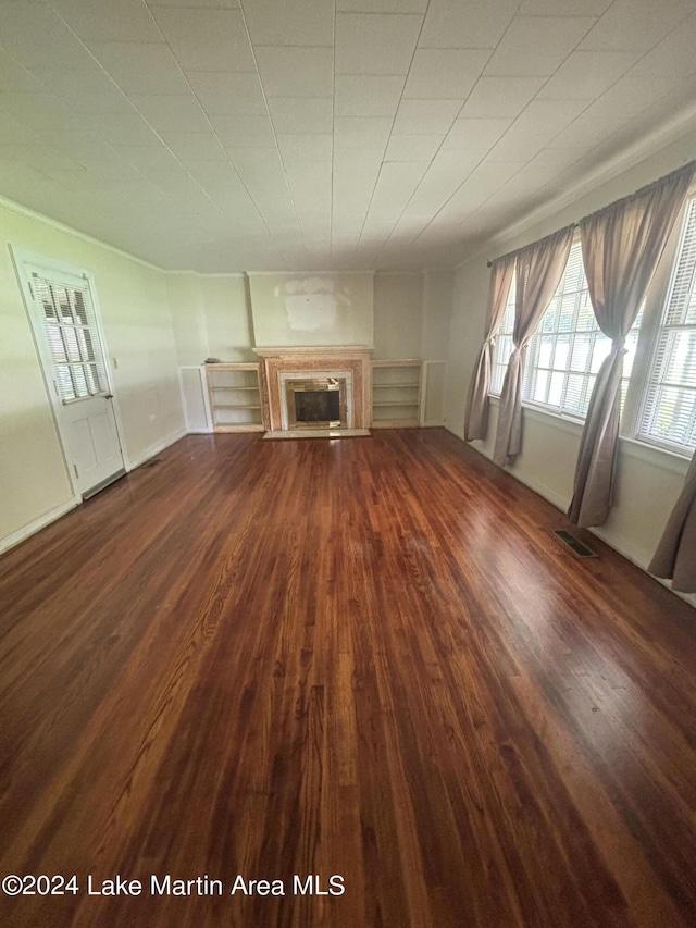 unfurnished living room featuring hardwood / wood-style floors