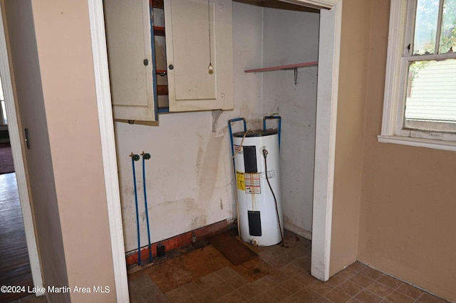 utility room with electric water heater