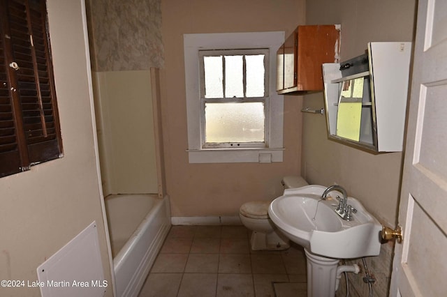 bathroom with tile patterned floors, sink, and toilet