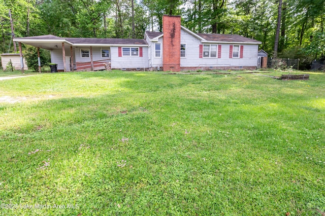 ranch-style home featuring a chimney, crawl space, a front lawn, and a carport