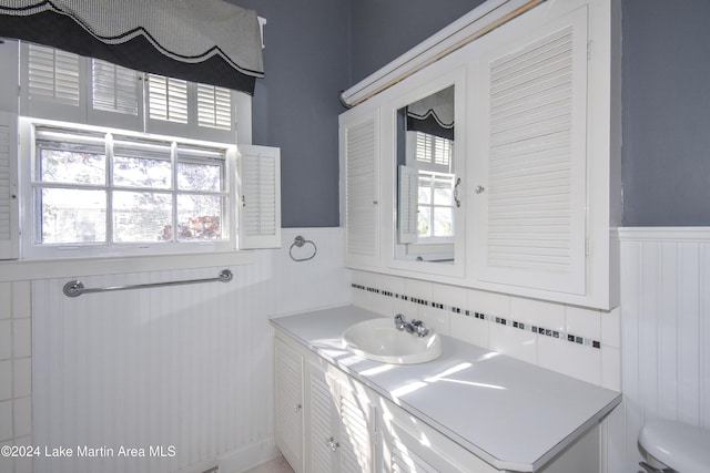 bathroom featuring vanity and toilet