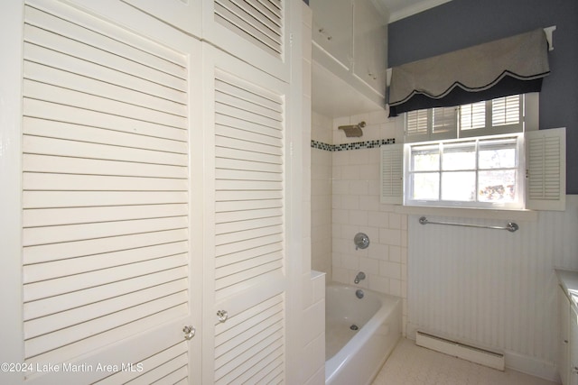 bathroom featuring tiled shower / bath combo and baseboard heating