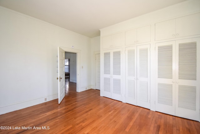 unfurnished bedroom featuring hardwood / wood-style floors