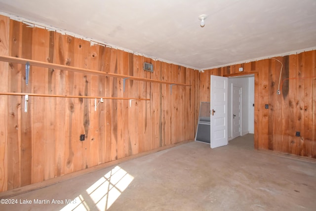 empty room featuring wood walls