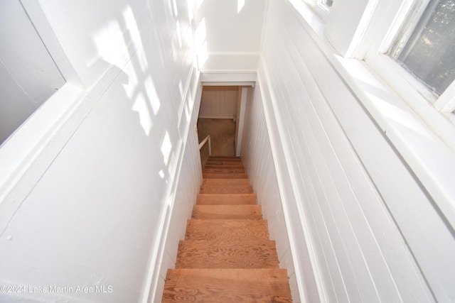 stairs featuring hardwood / wood-style flooring