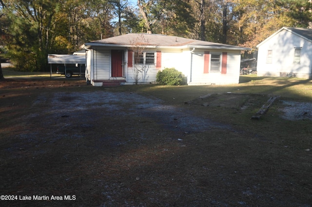 view of front facade with a carport