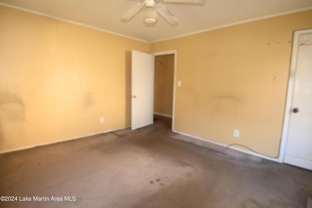 unfurnished room with ceiling fan, carpet, and ornamental molding