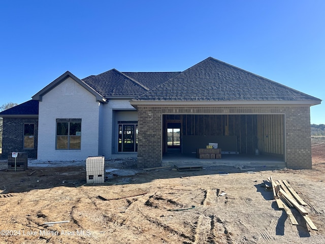 back of property with a patio area