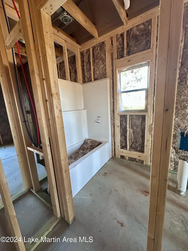 bathroom with concrete flooring