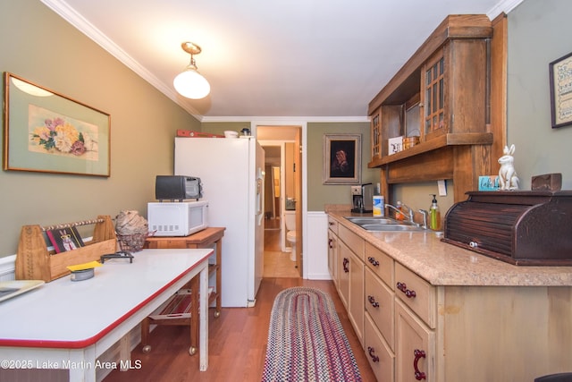 476 Brittney Ln, Jacksons Gap, AL 36861 - kitchen featuring white appliances, crown molding, wood finished floors, light countertops, and decorative light fixtures