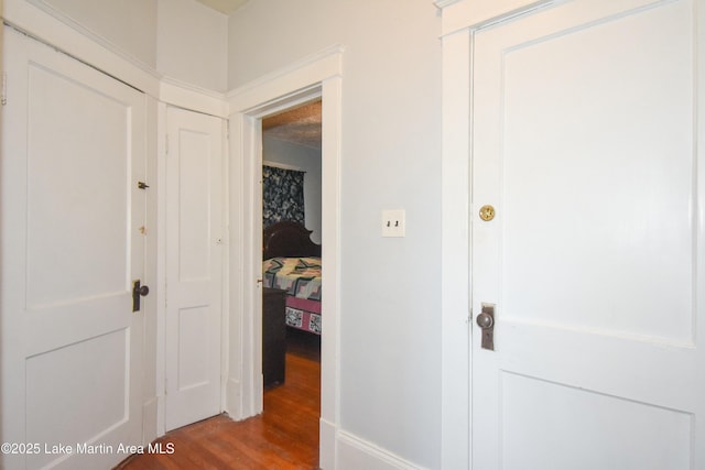 hall with wood finished floors