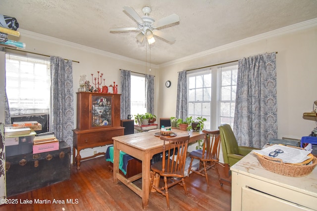 dining area with plenty of natural light, wood finished floors, and ornamental molding