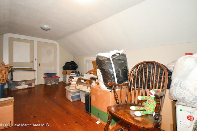interior space featuring hardwood / wood-style floors and lofted ceiling