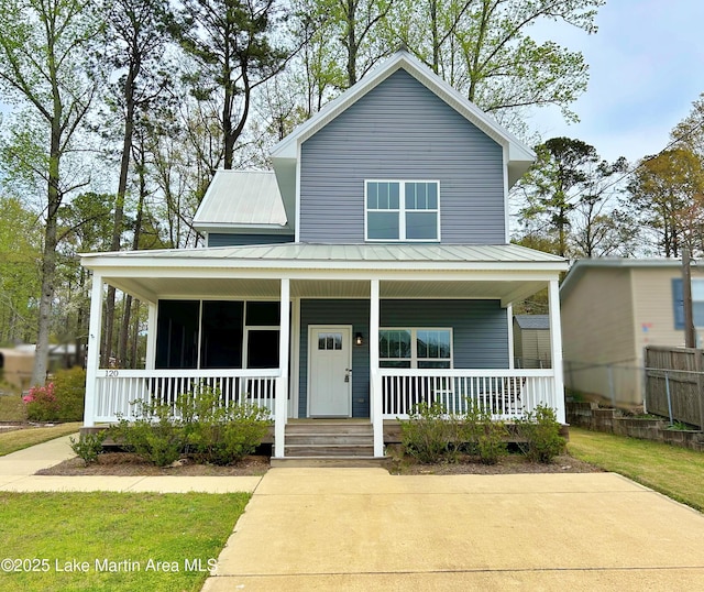 view of front of home with metal roof and a porch