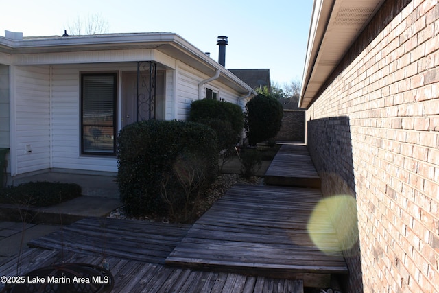 view of property exterior with brick siding