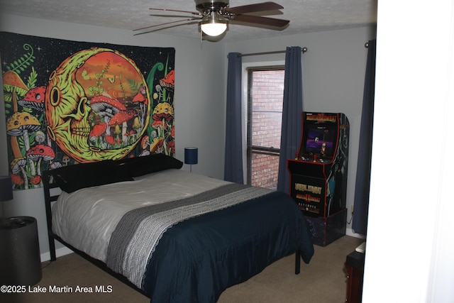 bedroom featuring carpet, ceiling fan, and a textured ceiling