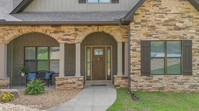 101 Mason Rd, Tallassee, AL 36078 - property entrance with stone siding, board and batten siding, a porch, and roof with shingles